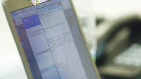 Computer screen with text of script at workplace closeup Stock Footage 234318779