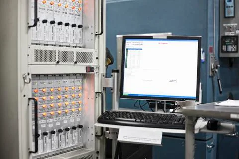 A computer screen at a work station in a reasearch and development site. Stock Photos