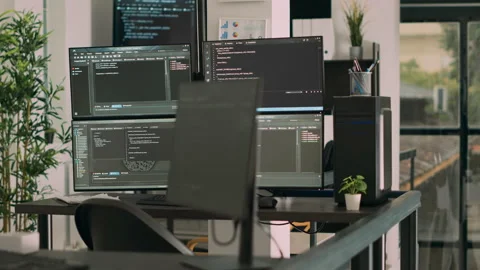 Computer screens on desk running programming code data algorithms Stock Footage 219900133