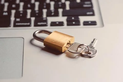Computer security and data protection concept. Laptop with an locked lock and Stock Photos