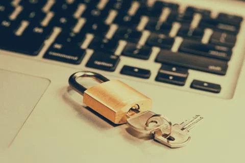 Computer security and data protection concept. Laptop with an locked lock and Stock Photos