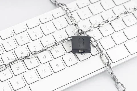 Computer Security concept. Chain and padlock on keyboard. Cyber security concept Stock Photos