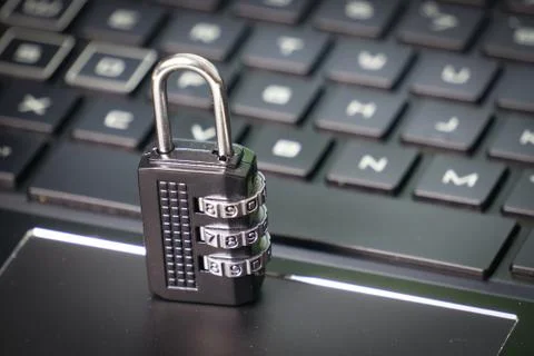Computer security concept with a closed padlock on the keyboard Stock Photos