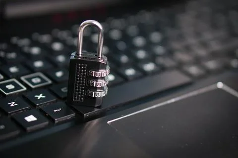 Computer security concept with a closed padlock on the keyboard Stock Photos