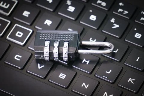 Computer security concept with a closed padlock on the keyboard Stock Photos