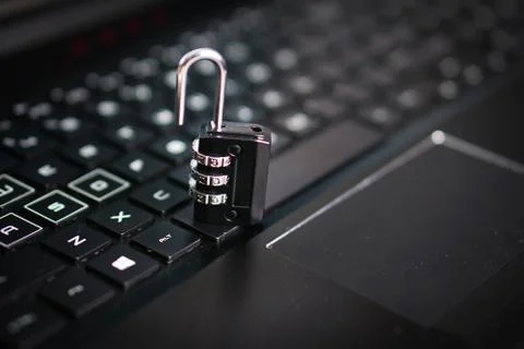 Computer security concept with a closed padlock on the keyboard Stock Photos