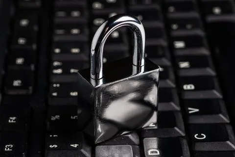 Computer security concept with a closed padlock on the keyboard Foto stock