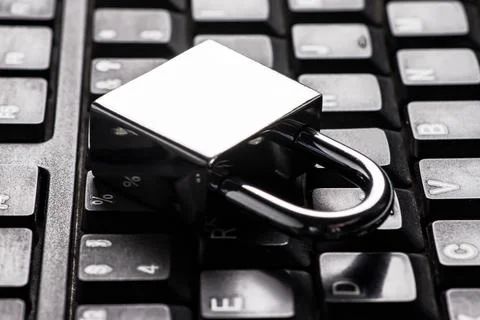 Computer security concept with a closed padlock on the keyboard Foto stock