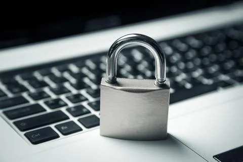 Computer security concept with a closed padlock on the keyboard Stock Photos
