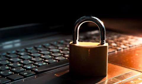 Computer security concept with a closed padlock on the keyboard Stock Photos