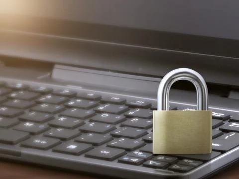 Computer security concept. Unlocked padlock on laptop keyboard. Symbol of saf Stock Photos