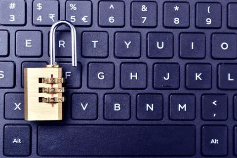 Computer security. Unlocked padlock on a laptop`s keyboard. Stock-Fotos