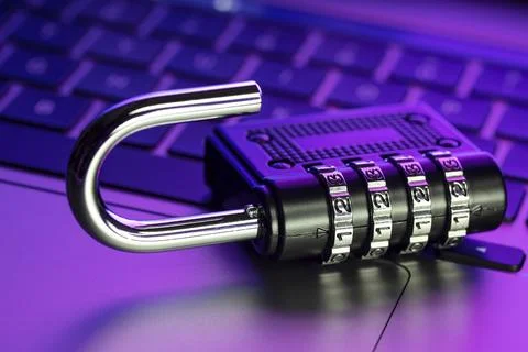 Computer Security Vulnerability concept. Open padlock on laptop with colorful Stock Photos