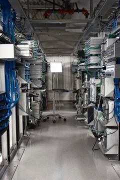 Computer server towers in racks in a computer server farm. Stock Photos
