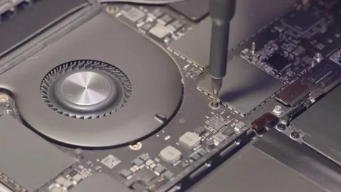 Computer Service. A man is repairing a laptop. Stock Footage 262571720