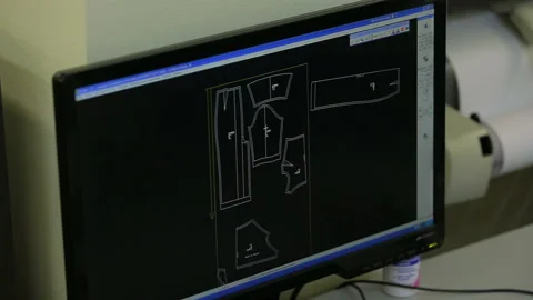The computer is in the sewing workshop. Creating a pattern in the program on the Stock Footage 95396229