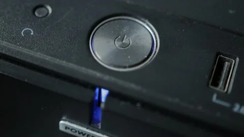 Computer shutdown power button with blue indicator. Modern technologies, macro Stock Footage 158235576