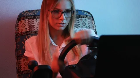 Computer simulation. Cheerful young gamer is expressing excitement while enjo 動画素材 113546499