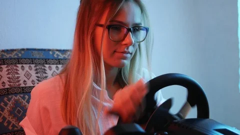 Computer simulation. Cheerful young gamer is expressing excitement while enjo Vidéo 113546655
