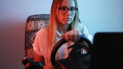 Computer simulation. Young gamer is expressing excitement while enjoying car  Stock Footage 113546592