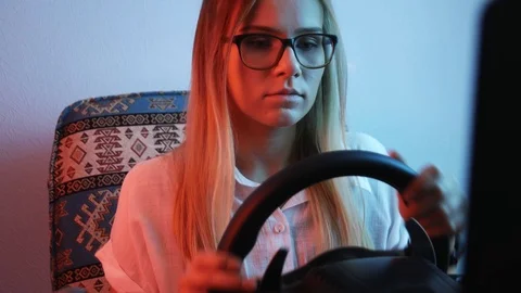 Computer simulation. Young gamer is expressing excitement while enjoying car  Stock Footage 113546646