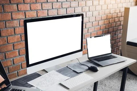 Computer of the software developer on the desk in the room office. Photos