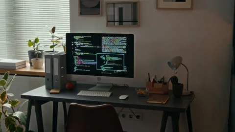 Computer with Source Code on Screen on Grey Wooden Desk in Modern Office Stock Footage 329611596