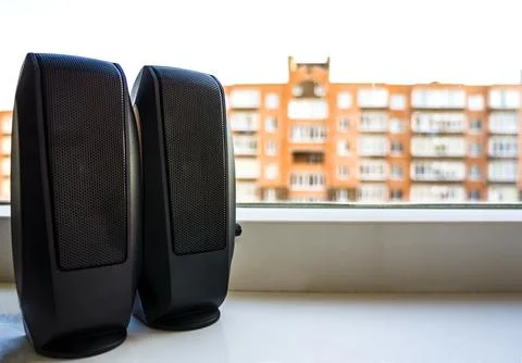 Computer speakers close up. columns At a window against the background of t.. Stock Photos
