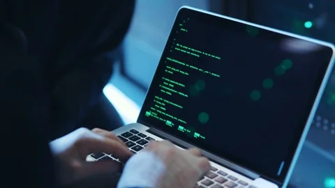 Computer spy typing green code on notebook trying to hack server system of data Stock Footage 120693667