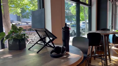 Computer on a stand placed on a cafeteria table table Stock Footage 246012596
