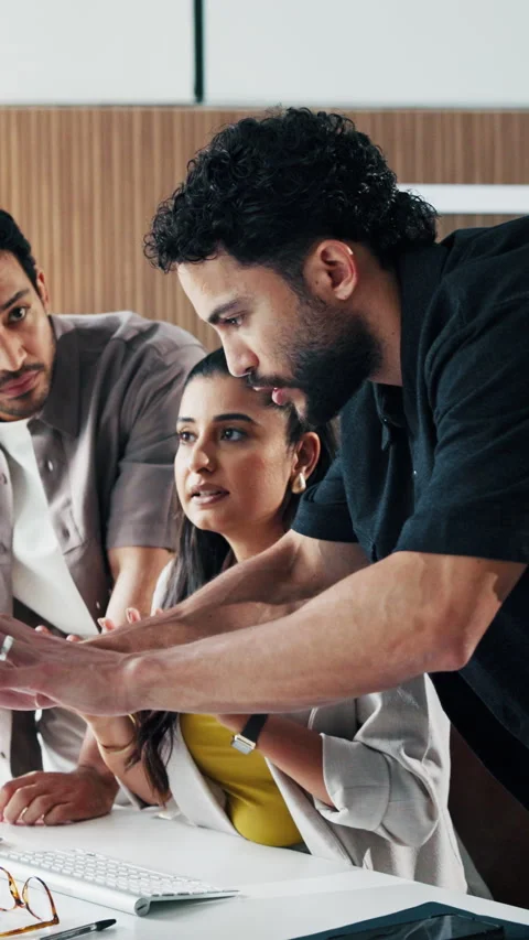 Computer, stress and talking with business people in office together for Stock Footage 331576668