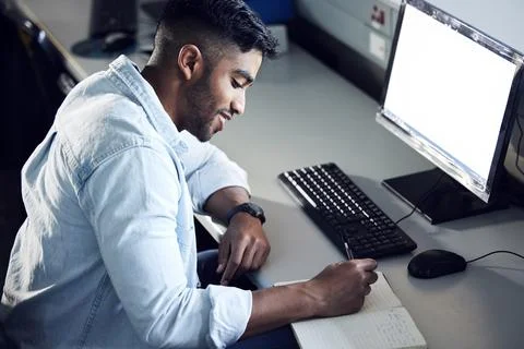 Computer, student or young man writing in book for education, learning and Stock Photos