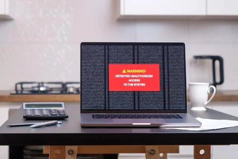 The computer system has been hacked. On the screen warning of unauthorized .. Stock Photos