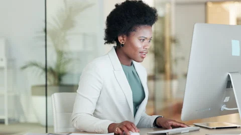 Computer systems analyst celebrating technology update success in an office Stock Footage 201641626