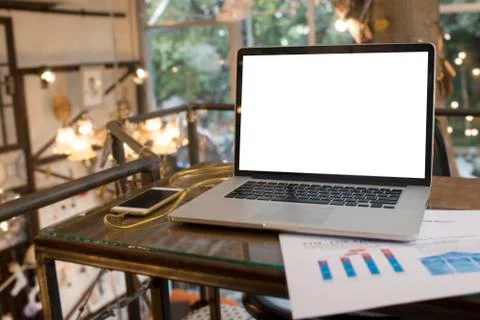 Computer on the table inside coffee shop Stock Photos