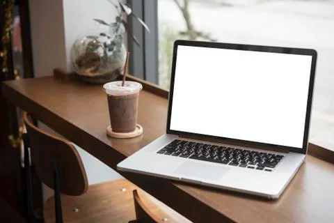 Computer on the table inside coffee shop Stock Photos