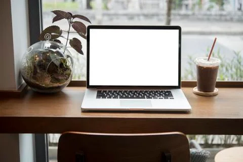 Computer on the table inside coffee shop Stock Photos