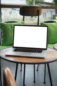 Computer on the table inside coffee shop Stock Photos