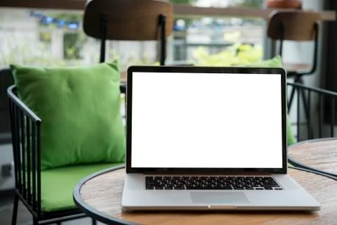 Computer on the table inside coffee shop Stock Photos