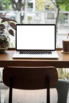 Computer on the table inside coffee shop Stock Photos