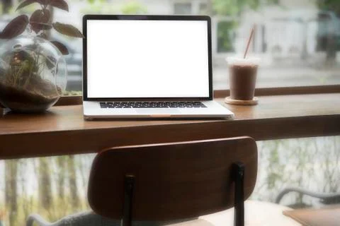 Computer on the table inside coffee shop Stock Photos