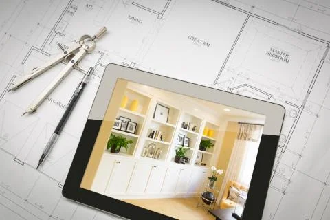 Computer Tablet with Finished Built-in Shelves and Cabinets Over House Plans, Stock Photos