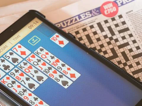 Computer tablet screen with a card game of Pontoon showing Stock Photos