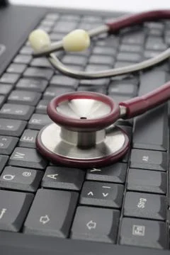 Computer Tastatur mit Stethoskop Stock Photos