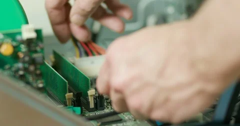 Computer tech removing RAM from a pc Stock Footage 123326939
