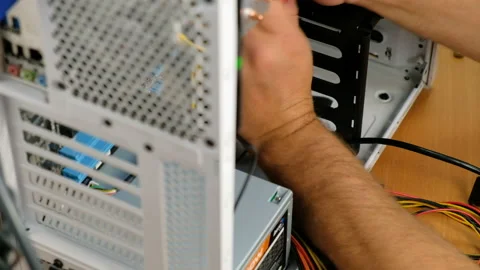 Computer technician assembles a computer. Build a home PC Stock Footage 99245900