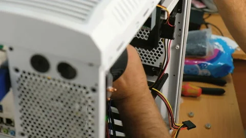 Computer technician assembles a computer. Build a home PC Stock-Footage 99246518