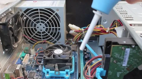Computer Technician Blows Canned Air Into CPU Vídeo Stock 49051101