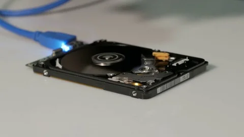 Computer technician with blue rubber gloves remove hard drive cover Video stock 74118041