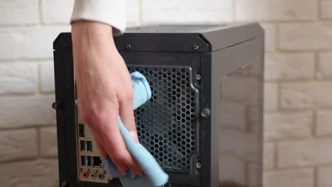 Computer technician cleaning a dusty pc case Stock Footage 334886642